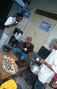 Local men hanging out at street side stall, Zanzibar