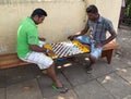 Local men play checkers on street