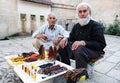 Local men selling beads and perfume at the entrance to Abrahams Pool in Urfa in Turkey. Royalty Free Stock Photo