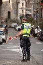 Local municipal police officer directing traffic Genoa