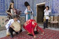 Local musicians playing musical instruments, singing and dancing, in Khiva, Uzbekistan