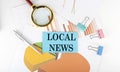 LOCAL NEWS text on the sticker on the paper diagram Royalty Free Stock Photo