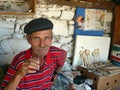 Local old craftsman drinking tea