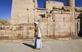 Local Man in Traditional Egyptian Clothing in Temple of Philae Royalty Free Stock Photo