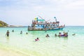Local people on a Boattrip enjoy the clear water and beach in Ko