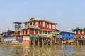 Local people are on longtail boat in front of Floating village Royalty Free Stock Photo