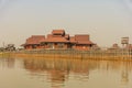 Local people are on longtail boat in front of Floating village Royalty Free Stock Photo