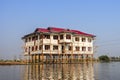 Local people are on longtail boat in front of Floating village Royalty Free Stock Photo