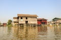 Local people are on longtail boat in front of Floating village Royalty Free Stock Photo