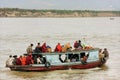 Local people riding in a boat on Ayeyarwady river near Mandalay, Myanmar