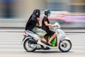 Local people riding moped or scotter on the streets of Hanoi, Vietnam, South East Asia