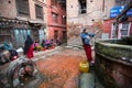 Local people sit in the street. The caste system is still intact today but the rules are not as rigid as they were in the past.