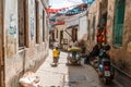 Local people on a street in Stone Town. Stone Town is the old part of Zanzibar City, the capital of Zanzibar, Tanzania