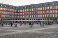 Local people and tourists at the Plaza Mayor and the bronze statue of King Philip III on a horse. Madrid, Spain Royalty Free Stock Photo