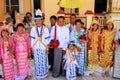 Local people in traditional costumes taking part in wedding ceremony at Mahamuni Pagoda, Mandalay, Myanmar