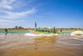 Local people using traditional boat in the middle of Musi River, Palembang, Indonesia. Royalty Free Stock Photo