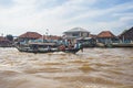 Local people using traditional boat in the middle of Musi River, Palembang, Indonesia. Royalty Free Stock Photo