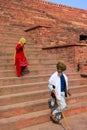 Local people walking down the stairs from Jama Masjid in Fatehpur Sikri, Uttar Pradesh, India