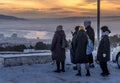 The local people are watching the sunset over the Selenga river, in Ulan-Ude, the capital of Buryatia, Russia