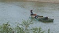 People Work on Flatboat Discharging Sand with Pipe