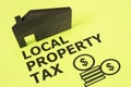 Local property tax is shown on the photo using the text Royalty Free Stock Photo