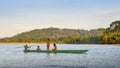 Local Quechua tribe teenagers in the Ecuadorian Amazon on a canoe on the river Napo Royalty Free Stock Photo