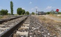 Local railway with the asphalt road crossing in a countryside, Afyonkarahisar, Turkey