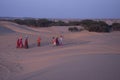 Local Rajathani women People walking on the sand dunes at Khuri,