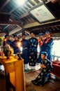 local religious leaders are blessing a a bridge and showing some food sacrifice in traditional dress with candles