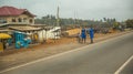 Local residents are walking along the street in Cape Cost