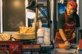 Local seller prepare and sale street food, meal and hot snacks in Chinatown district