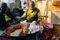 A local selling meat and onions at the street market in Delhi, India.