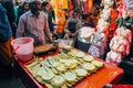 A local selling street food in Delhi, India.