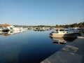 The local small harbor paints a picturesque scene with yachts and boats neatly parked