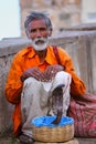 Local snake charmer sitting in the street of Jaipur, Rajasthan,