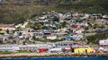 Local South African township housing residence area around Hout Bay hill side landscape from ocean