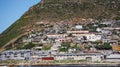 Local South African township housing residence area around Hout Bay hill side landscape from ocean