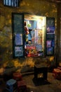 Local street food vendor at a corner in Hanoi's Old Quarter at night.