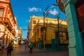 Local street with houses of colonial architecture. Santiago de Cuba, Cuba. Royalty Free Stock Photo