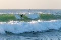 Local surfer riding waves