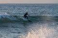 Local surfer riding waves