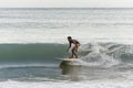 Local surfer riding the waves in Sri Lanka