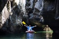 Local thai people guide paddle canoe boat of trip tour in sea ocean bring thai traveler women travel visit Prasat Hin Pan Yod in Royalty Free Stock Photo