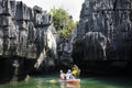 Local thai people guide paddle canoe boat of trip tour in sea ocean bring travelers women travel visit Prasat Hin Pan Yod in Mu Ko Royalty Free Stock Photo