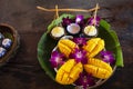 Local thai snacks dessert of specially cooked Mango and sweet glutinous sticky rice served on utensil retro vintage style tea time Royalty Free Stock Photo