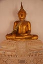 Local Thai Style. Smiling Face Golden Buddha In Buddhist Temple Royalty Free Stock Photo