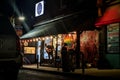 Local Toronto band playing on a corner store of Kensington Market. In a dark neighborhood, this band shines under the lit canopy.