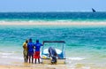 Local tour guides and sandy ocean view in Mozambique