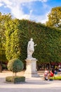 Local and Tourist enjoy sunny days in famous Tuileries garden. Jardin des Tuileries is a public garden located between Louvre Royalty Free Stock Photo