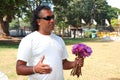 Local tourist guide with bouquet of lilies